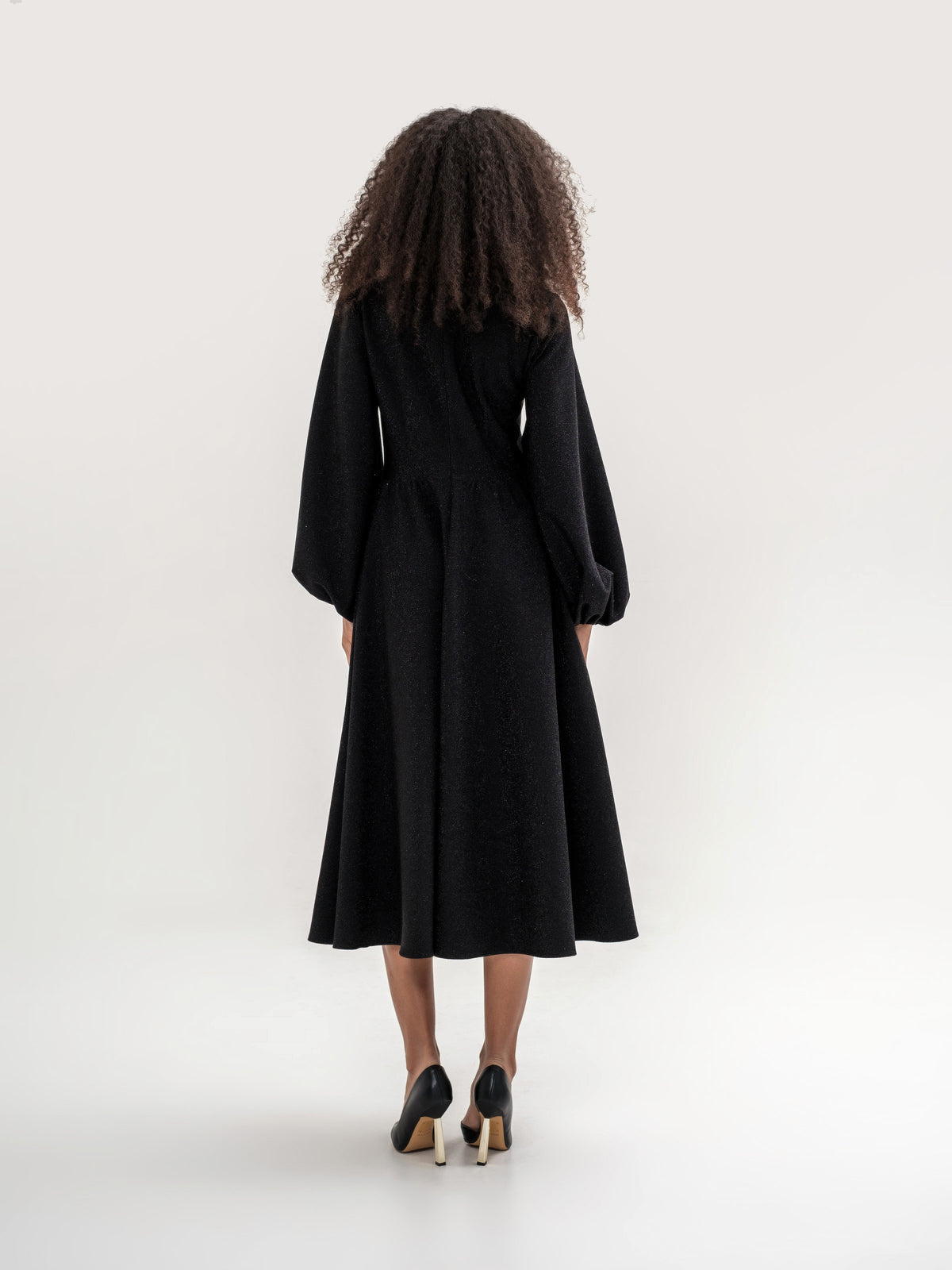 Black shiny thread midi dress with voluminous sleeves and a V-neck