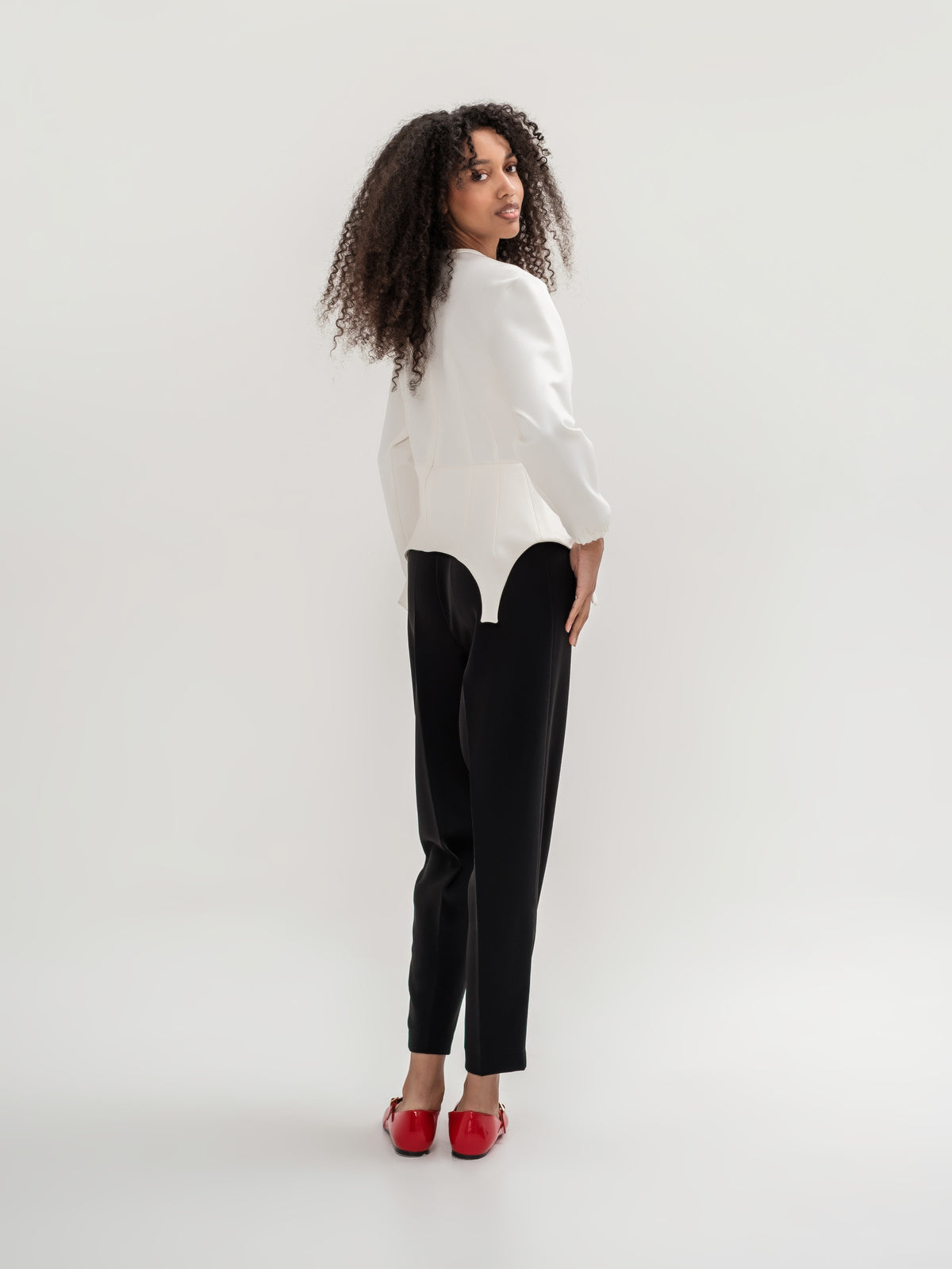 Formal black trousers and white garter inspired top with long sleeves 