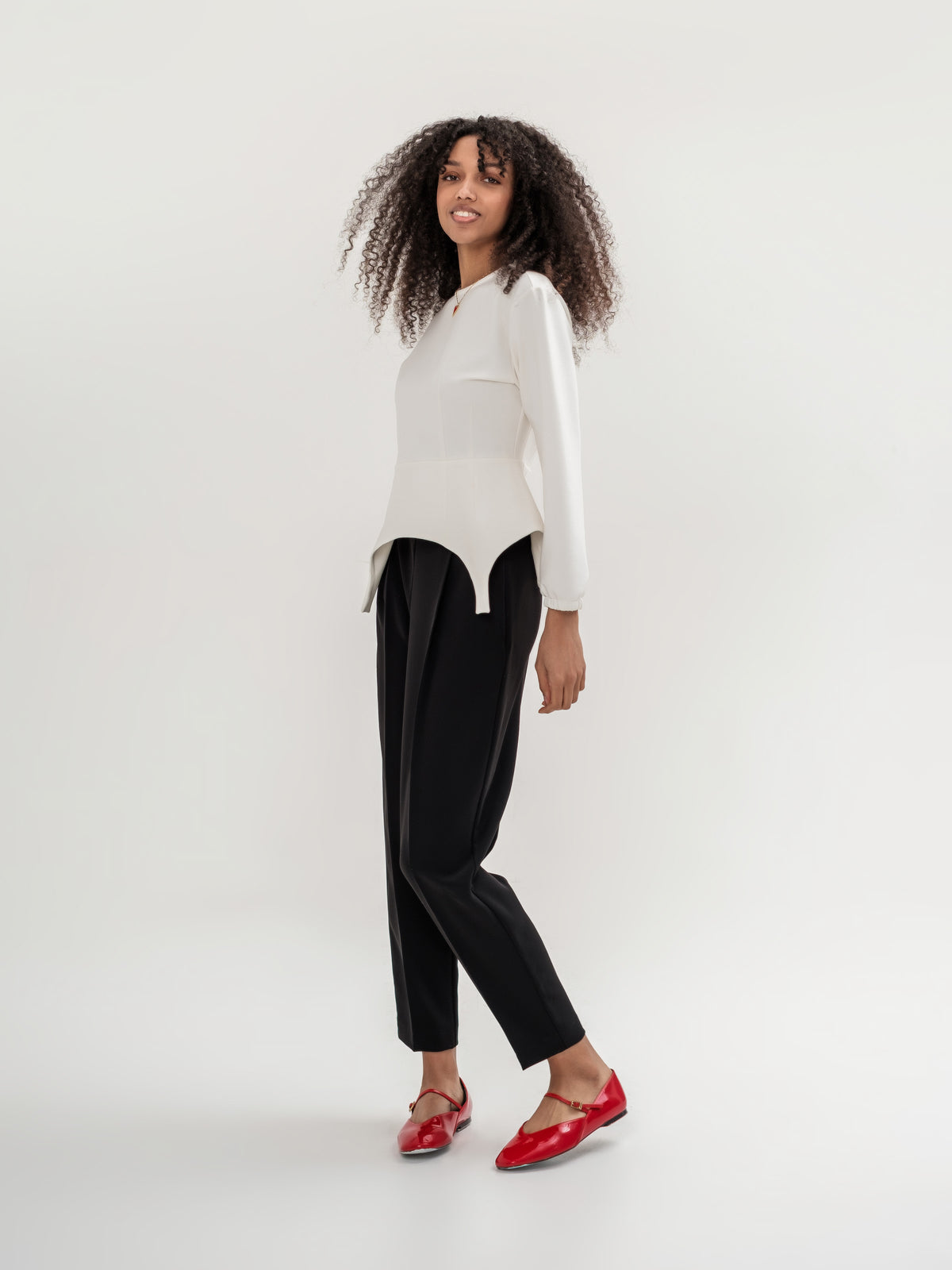 Formal black trousers and white garter inspired top with long sleeves 
