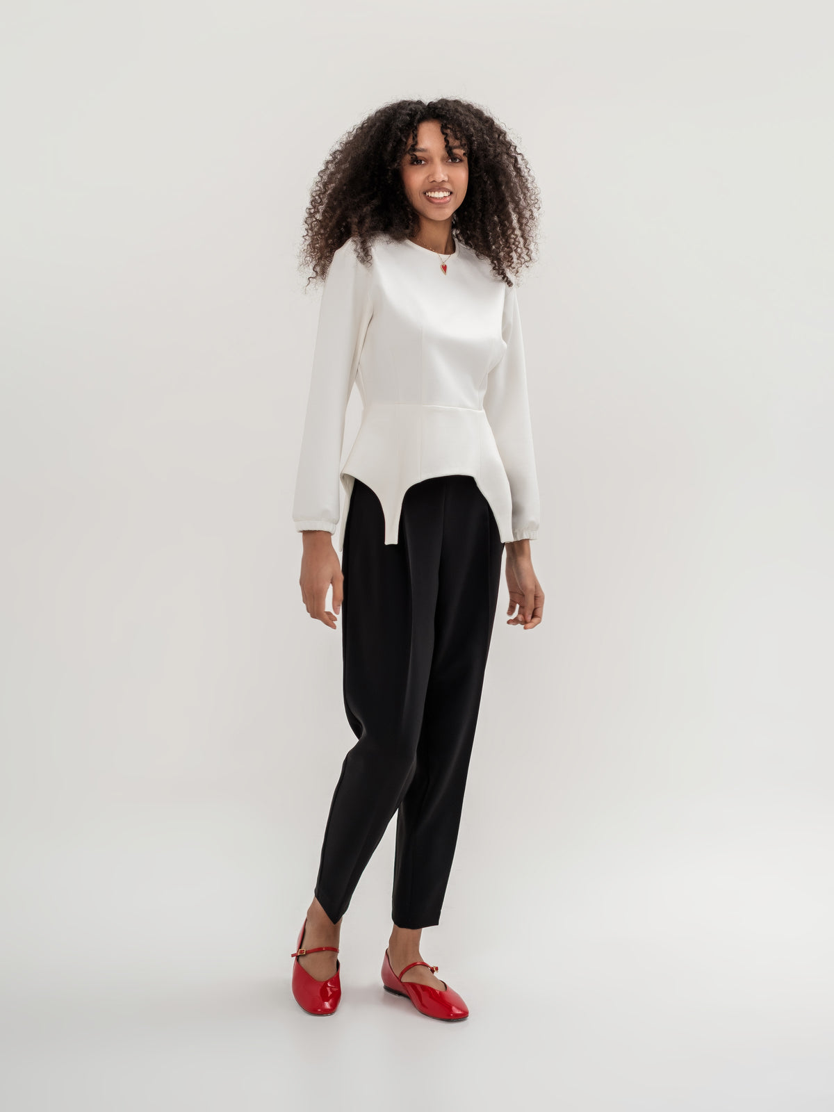 Formal black trousers and white garter inspired top with long sleeves 