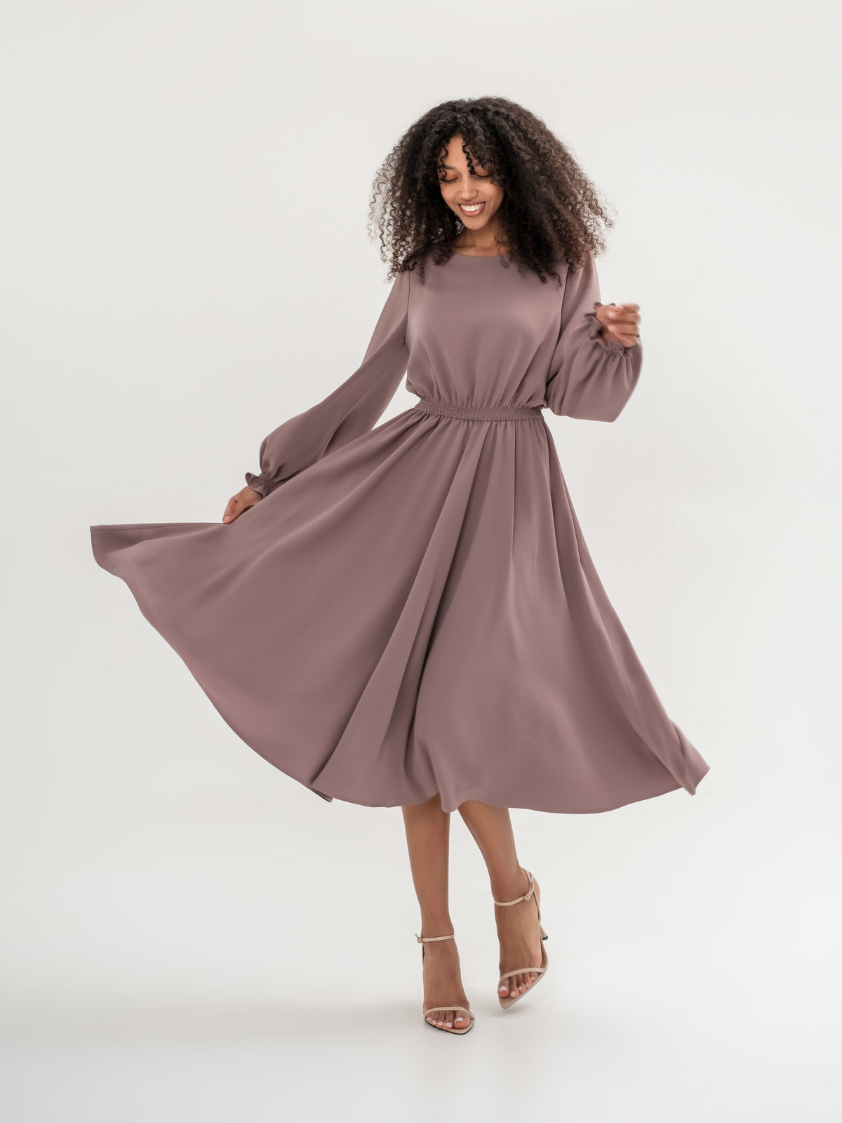 Classic midi cappuccino dress with long sleeves with elastic in the waistband and cuffs