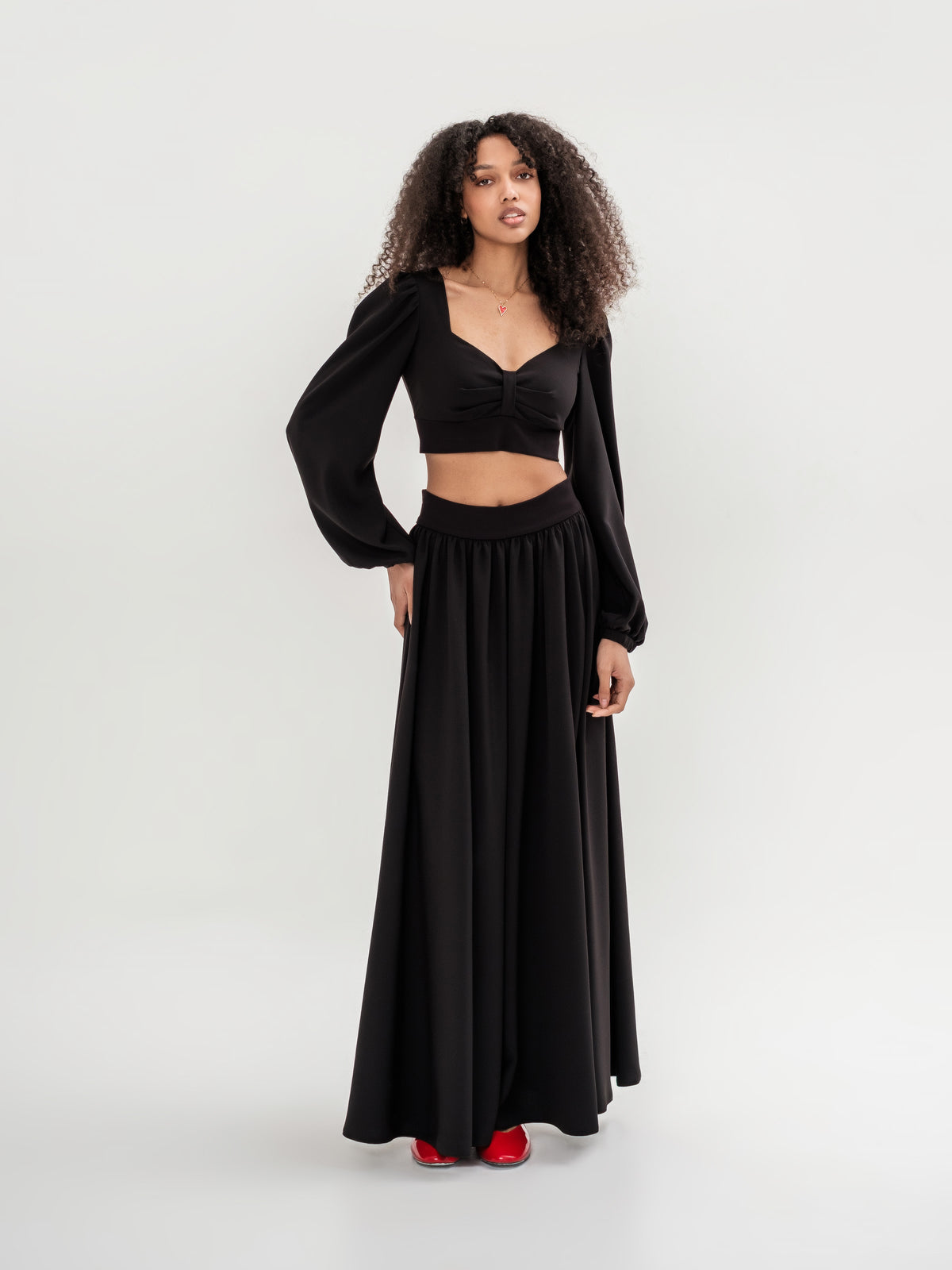 Set, black top with long sleeves and skirt