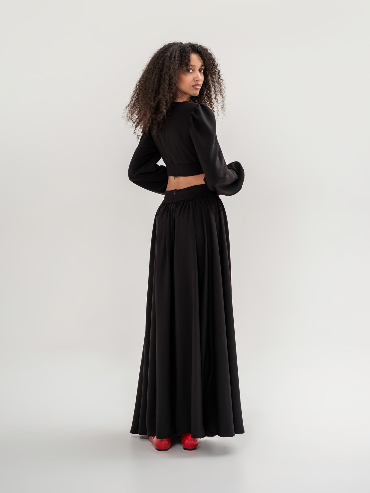 Black crop top with long sleeves and long wide skirt