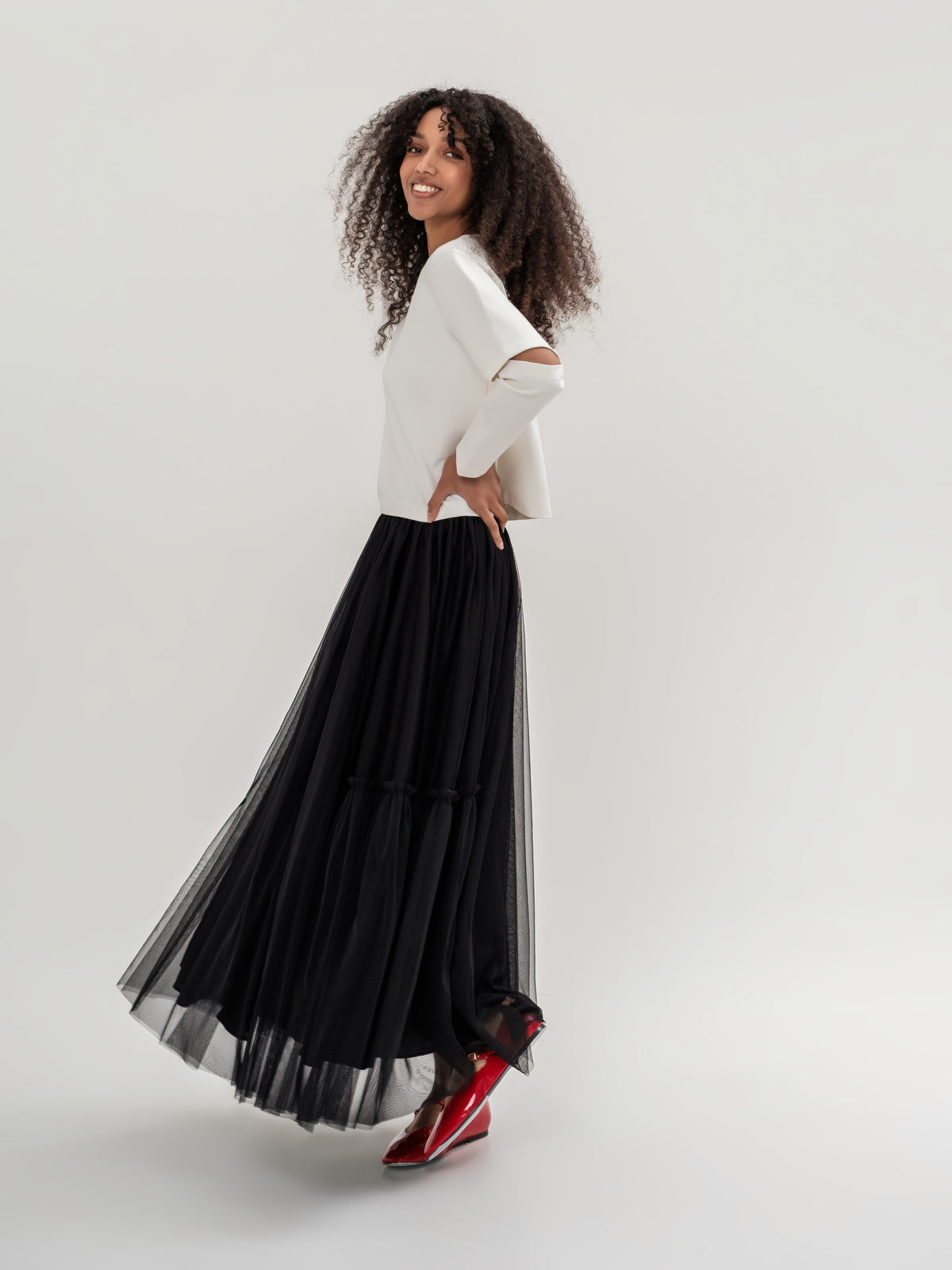 White top and black tulle lined skirt with elastic waist one size