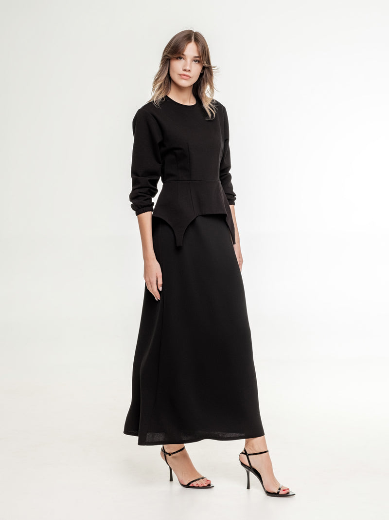 black feminine top with long black A shaped skirt