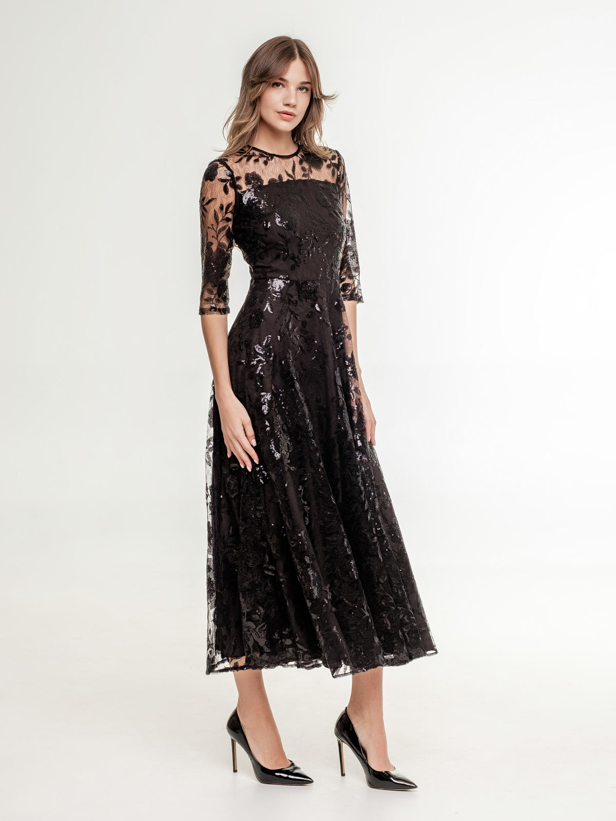 black_midi_lace_dress_with_luxurious_sequins_and_flowers and medium long sleeves top on the model