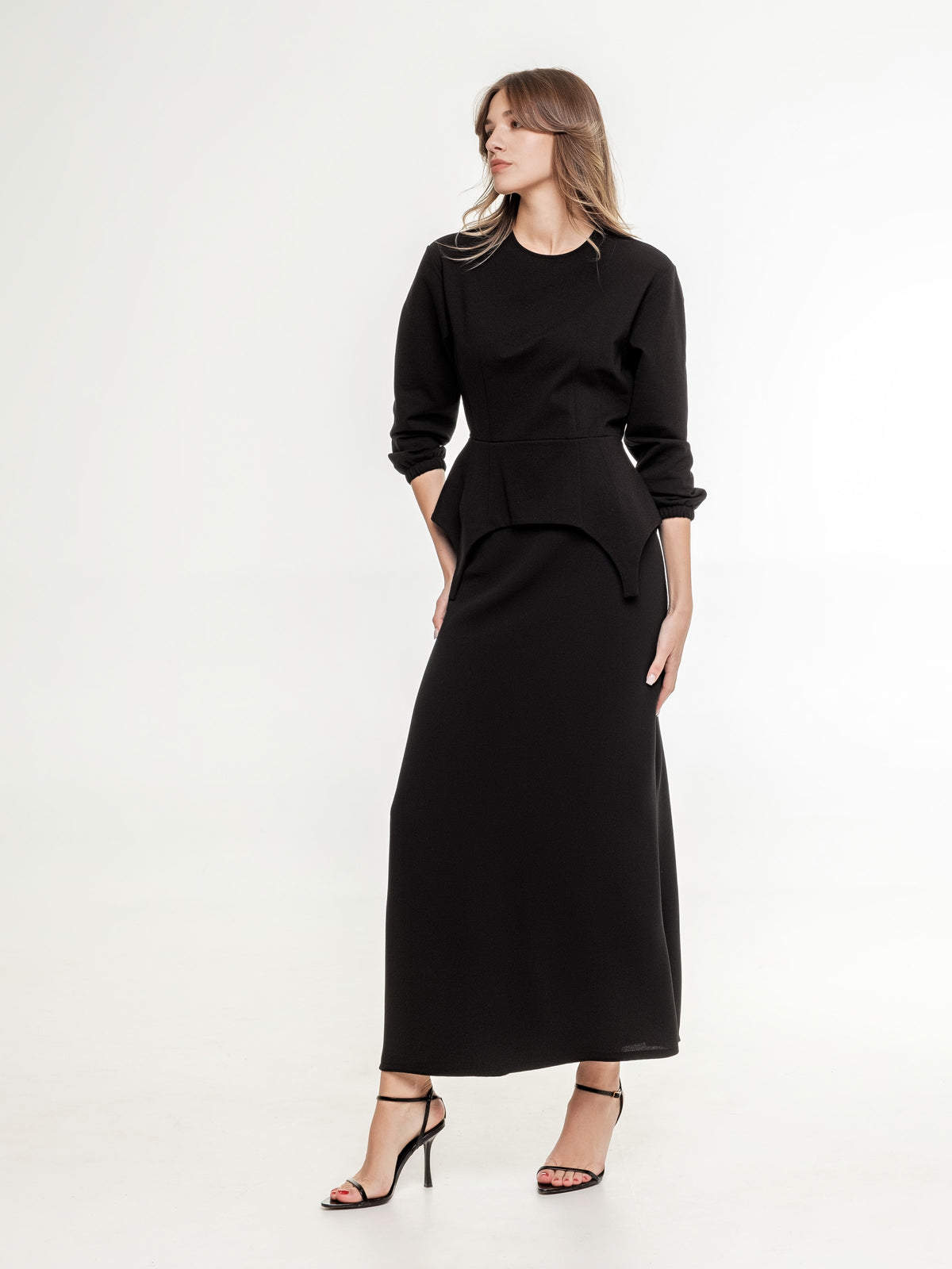 black set of top with long sleeves and long skirt
