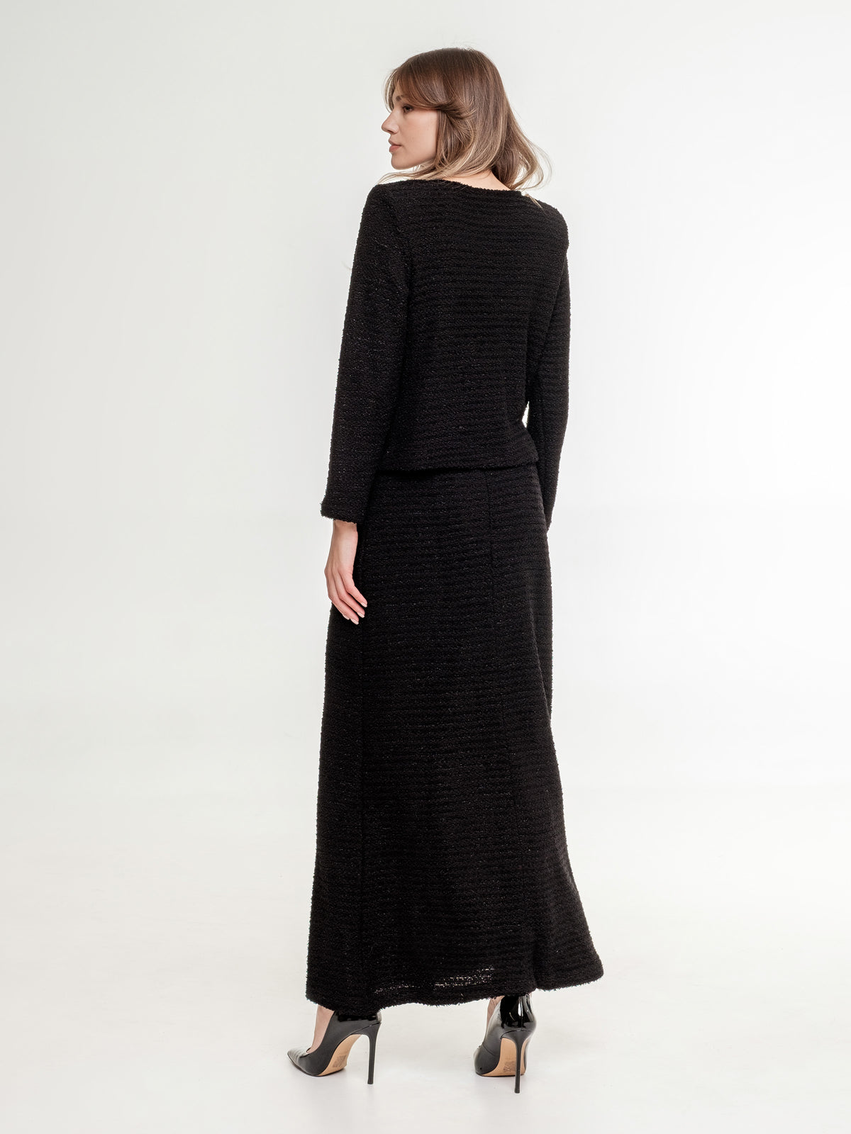 black textured top with long sleeve and long skirt back view