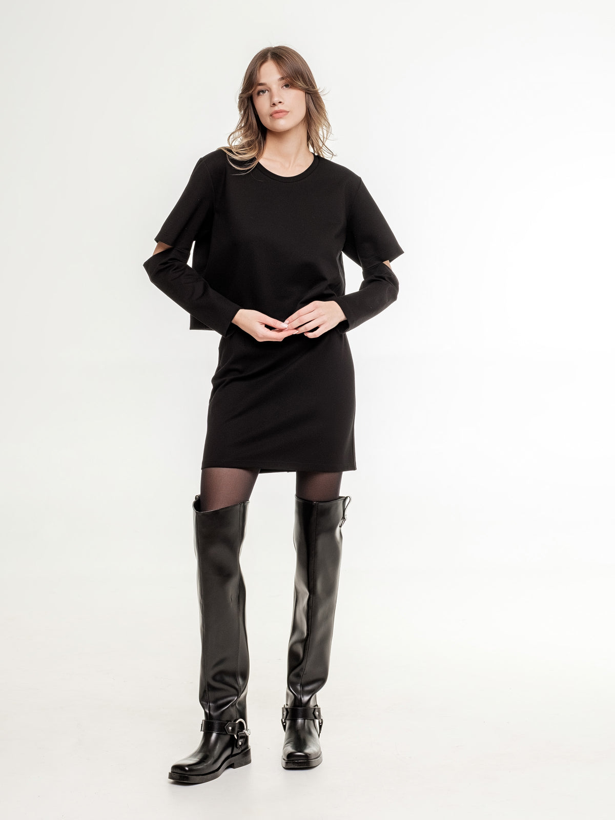 black top with long sleeves elbow cuts  and mini black skirt