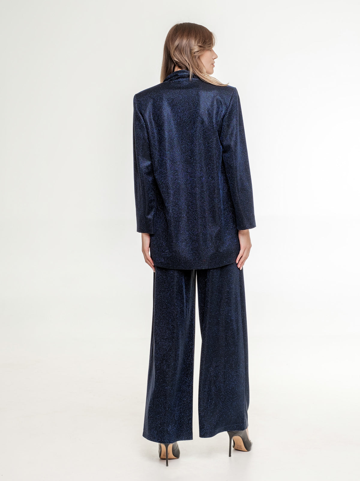 dark blue glitter suit with trouser wide fit female from the back
