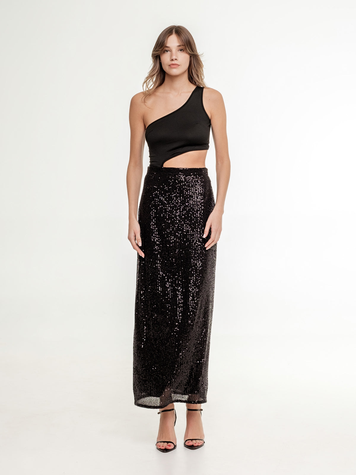 glitter black long skirt view from the front on the model