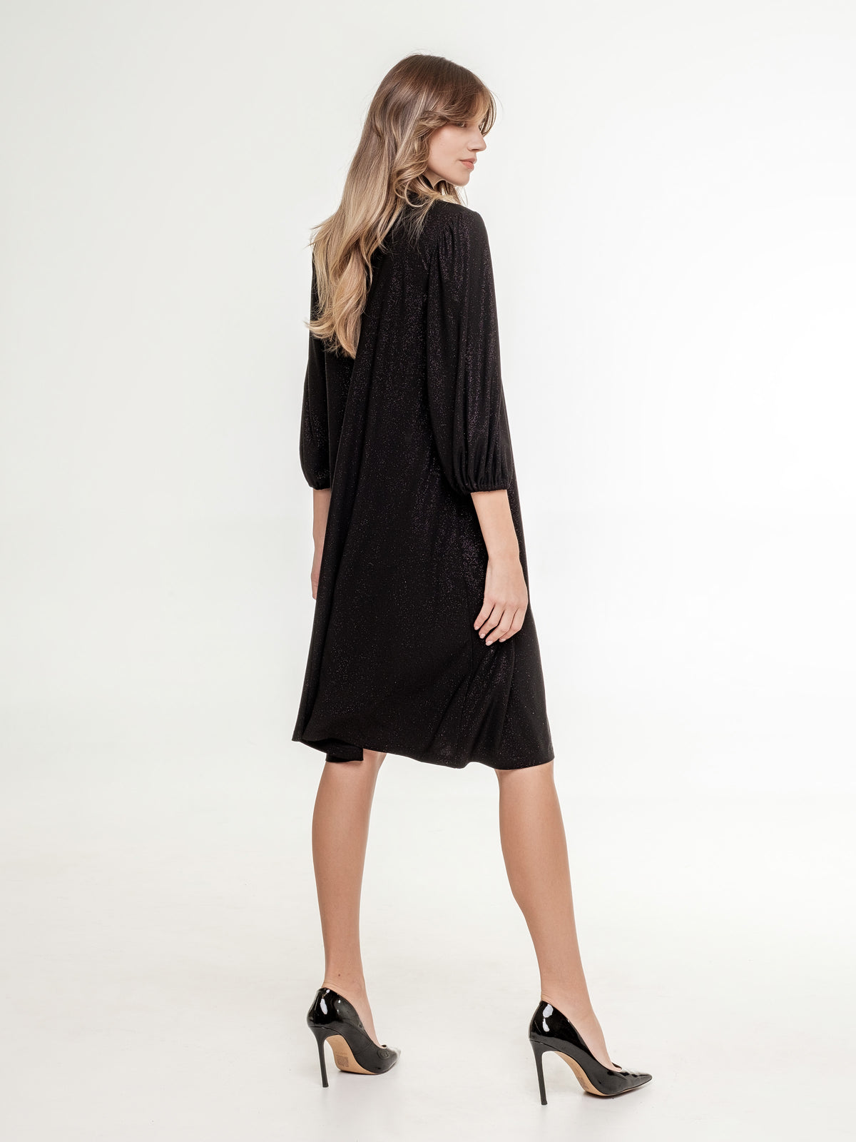 short_glossy_black_dress_with_high_neck_line 3/4 sleeves side view