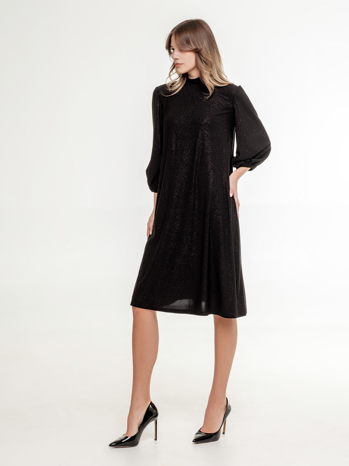short_glossy_black_dress_with_high_neck_line 3/4 sleeves side view model
