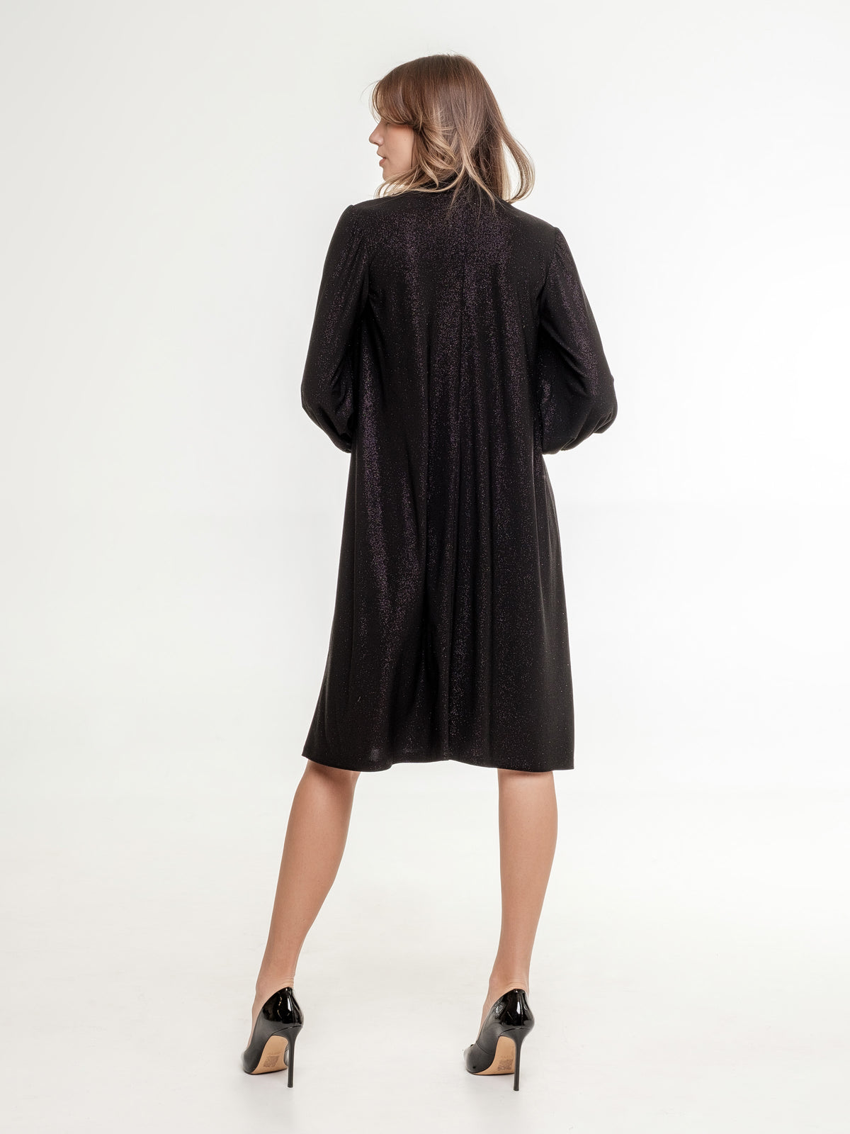 short_glossy_black_dress_with_high_neck_line back view