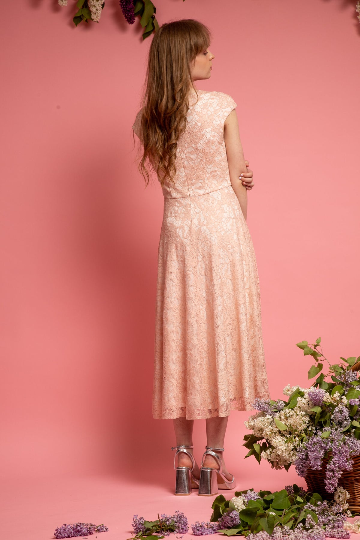 peach long lace dress for wedding guests with white underlining from the back