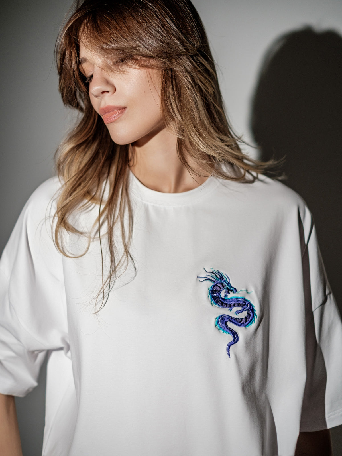 white T-shirt with dragon closeup