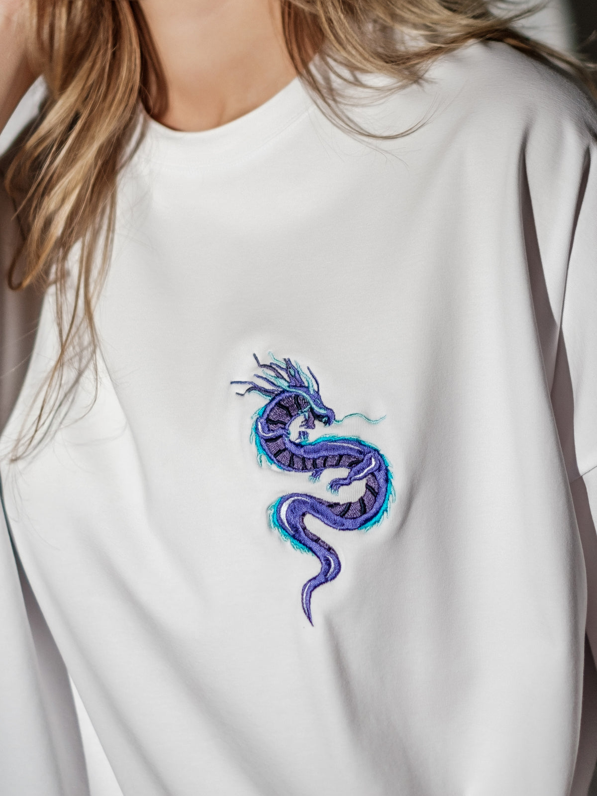 white T-shirt with dragon closeup embroidery